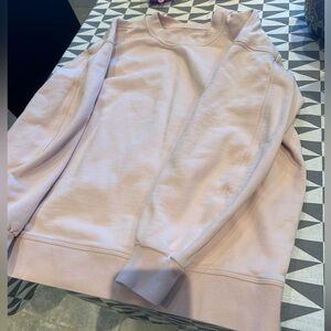 Light pink lululemon sweatshirt fits as a 4